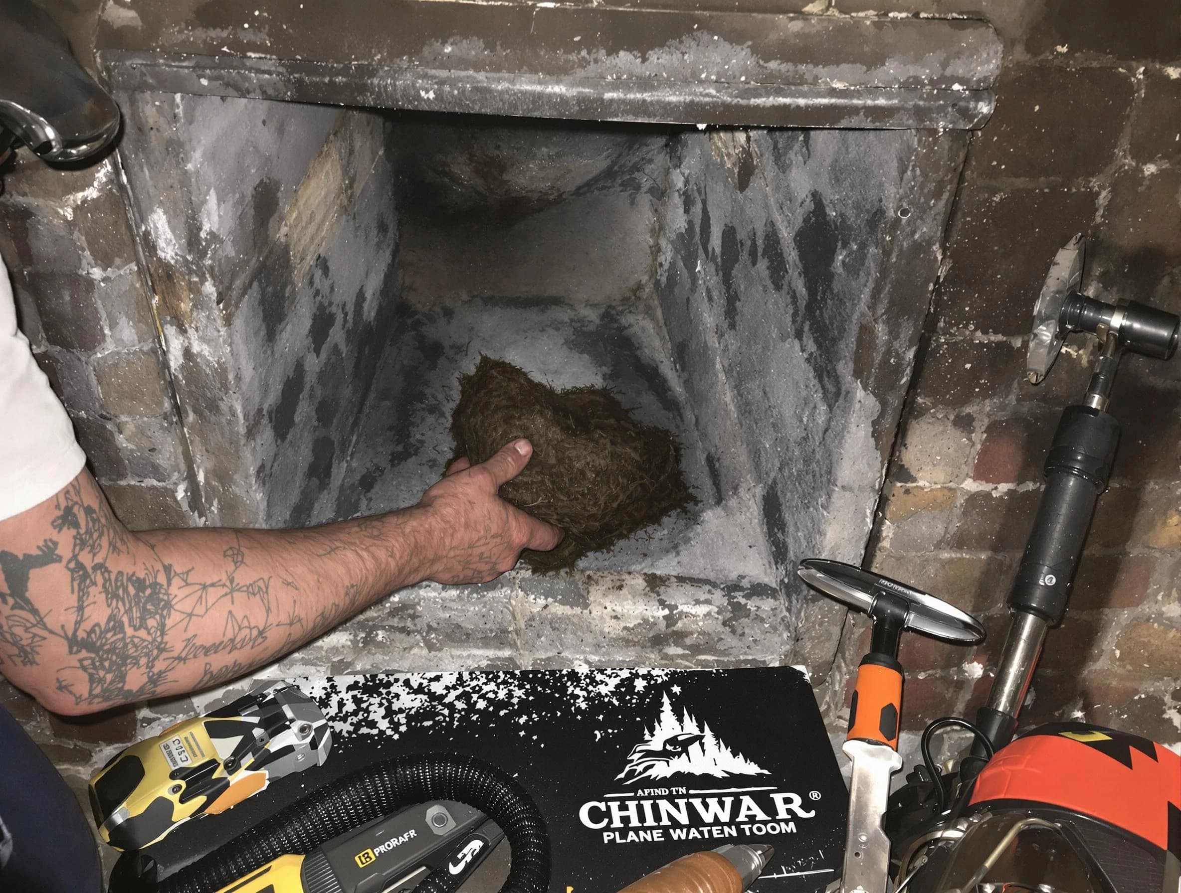 Robinson Chimney Sweep safely removing debris and screening chimney in Robinson, PA